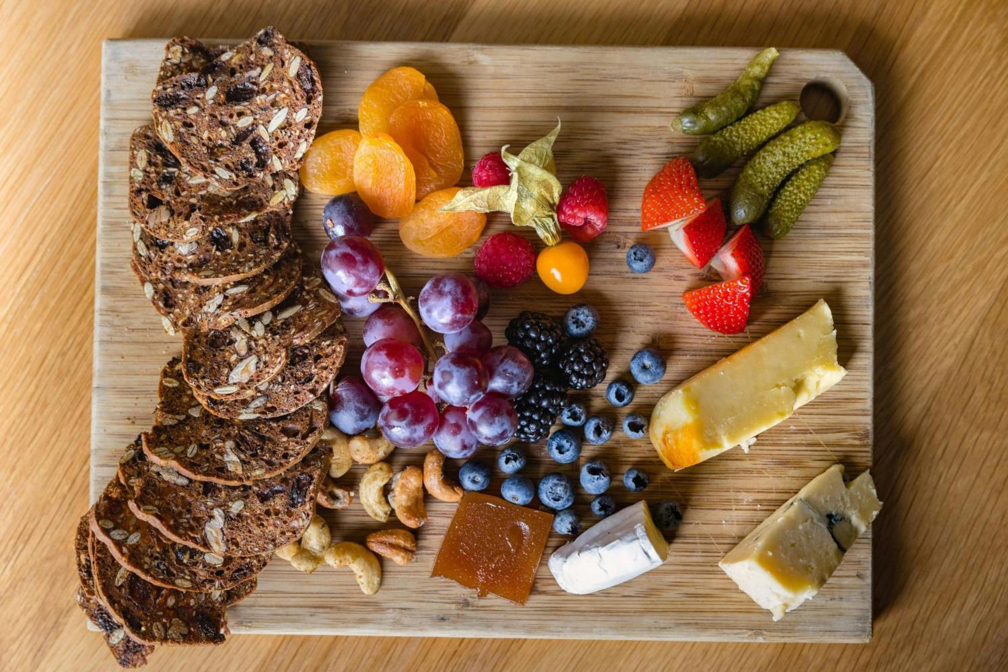 The Westin Resort & Spa, Whistler Exterior photo A cheese board with fruit and crackers